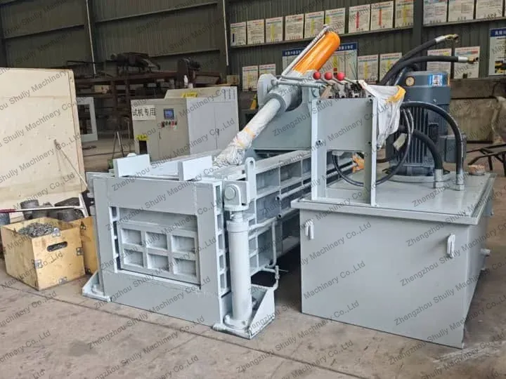 Metal scrap baling machines