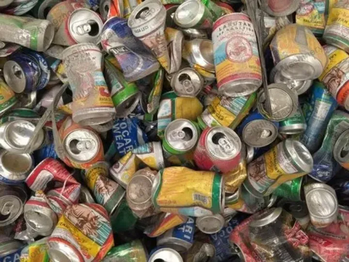 Aluminum cans prior to processing in the can flattener